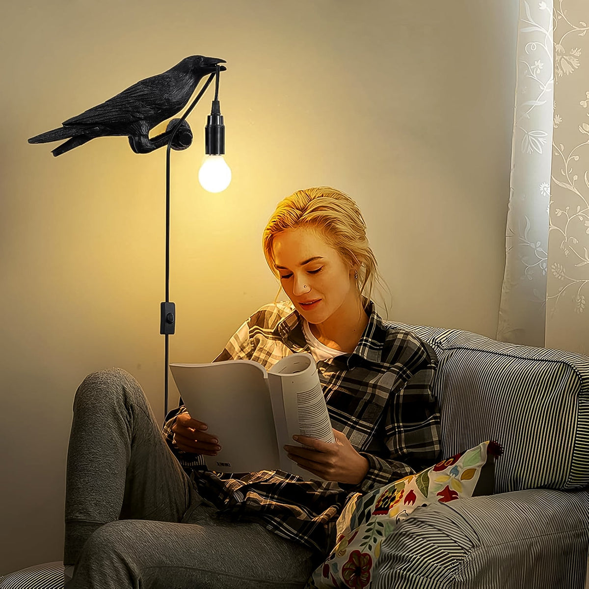 Side view of the crow table lamp, highlighting its intricate feather details and sturdy base.