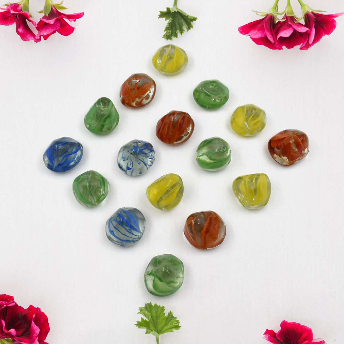 A heap of various multi-color decorative stones highlighting their smooth texture.