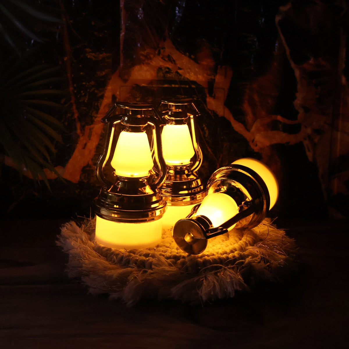 Decorative flameless LED candles shaped like vintage lanterns with warm glow