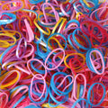 A neatly stacked pile of colorful multicolor rubber bands on a clean white background.