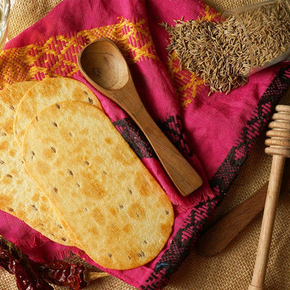 Close-up of thin, crispy Khakhra wheat chips, ideal for snacking.